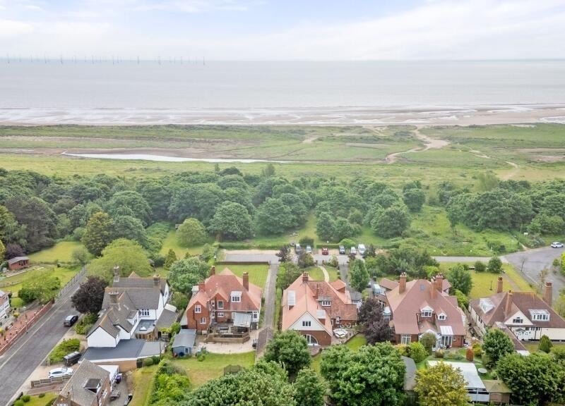 The sea beyond the front of the home.