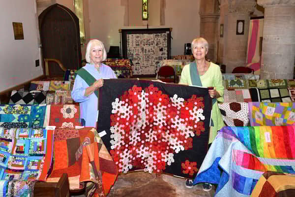 From left - Lorna Bushnell and Annabel Groom show off quilts on display at Cranwell church. Photo: Mick Fox