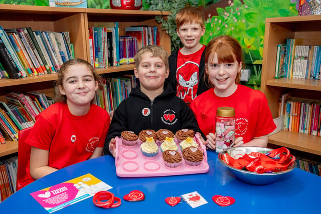 Pupils with some of the heart-themed items in aid of Heart Link. Pictured, from left, are Edith-Rose Ballam, 10, William Hough, six, Alfie Dean, seven, and Ellie Dean, nine.