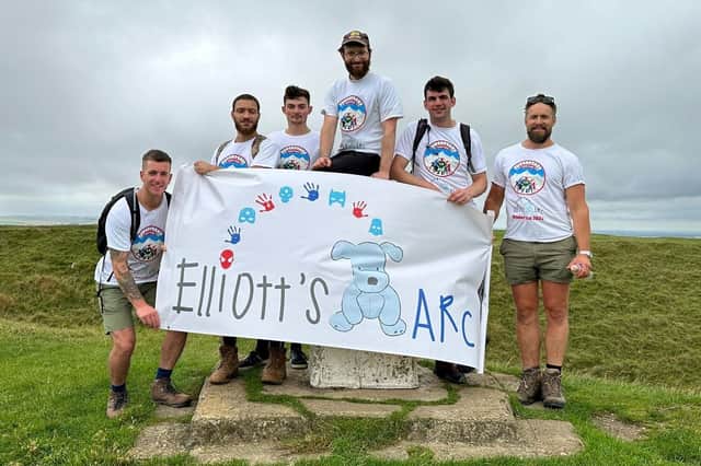 Chris Peto (third from right) and some of those who will be joining him on the National Three Peak Challenge in memory of Chris' son Elliott, who sadly died in December, aged just five. The group are pictured at Uffington hill fort during training.