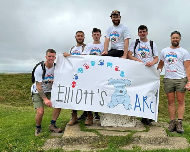Chris Peto (third from right) and some of those who will be joining him on the National Three Peak Challenge in memory of Chris' son Elliott, who sadly died in December, aged just five. The group are pictured at Uffington hill fort during training.