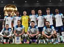 England players pose for a squad photo ahead of their Group B clash with Wales - with a 3-0 victory in the game setting up a last-16 tie with Senegal. (Photo by PAUL ELLIS/AFP via Getty Images)