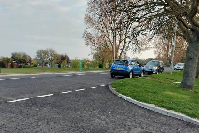 A reader is calling for double yellow lines on Roman Bank because she says parked cars are blocking the view the drivers at the junction.