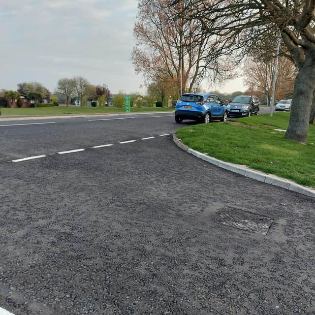 A reader is calling for double yellow lines on Roman Bank because she says parked cars are blocking the view the drivers at the junction.
