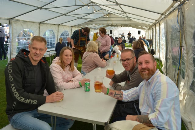 Festival goers enjoying their drinks and the music on offer in the main marquee