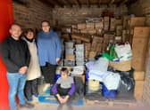 Volunteers with the donations already collected.