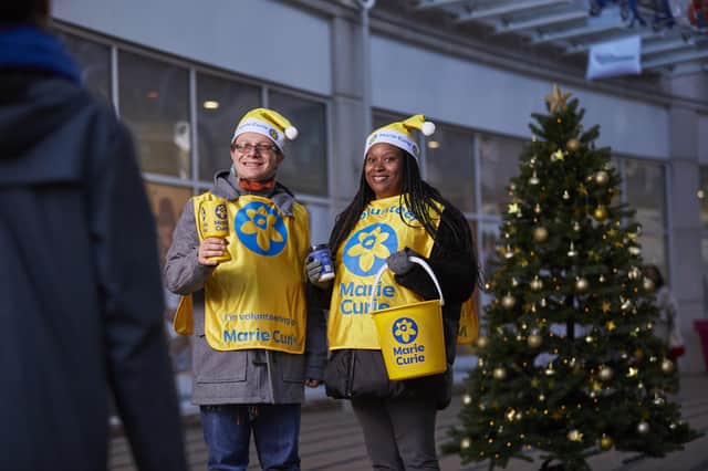 Marie Curie volunteers collecting Christmas donations.