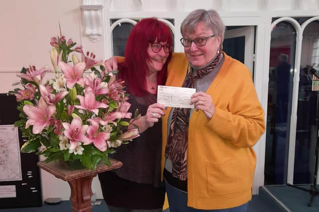 Rebecca Harris from Barnardo’s (left) and Audrey Moore from Eastgate Union Church smile as the cheque is handed over