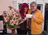 Rebecca Harris from Barnardo’s (left) and Audrey Moore from Eastgate Union Church smile as the cheque is handed over
