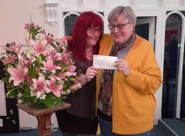 Rebecca Harris from Barnardo’s (left) and Audrey Moore from Eastgate Union Church smile as the cheque is handed over