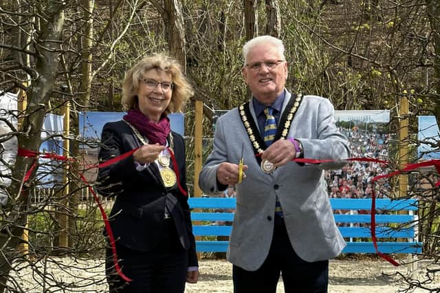 City Mayor of Bad Gandersheim Franziska Schwar and Mayor of Skegness Coun Tony Tye cutting the ribbon of the beach garden.