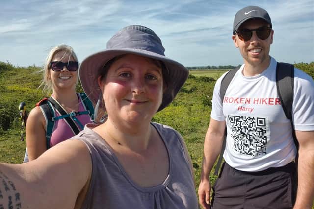 Carolyn, front, with supporters Billie and Harry on the 28-mile walk.