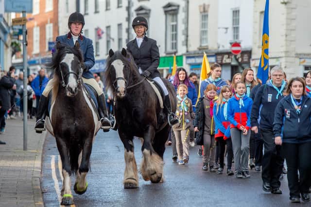 Horses accompany the parade.