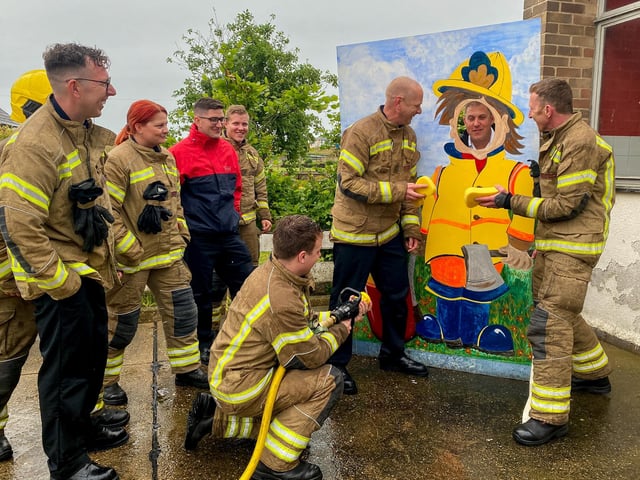 Mablethorpe Firefighters soak their Boss, Watch Commander Matthew Ward.