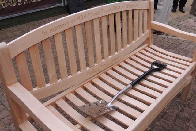 The memorial bench and spade.