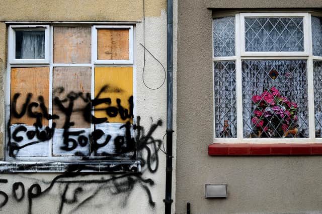 A derelict house in the Cobridge area of Stoke-On-Trent, Staffordshire that is being sold by the council for £1 sits next to an occupied house that appears to be well looked after.