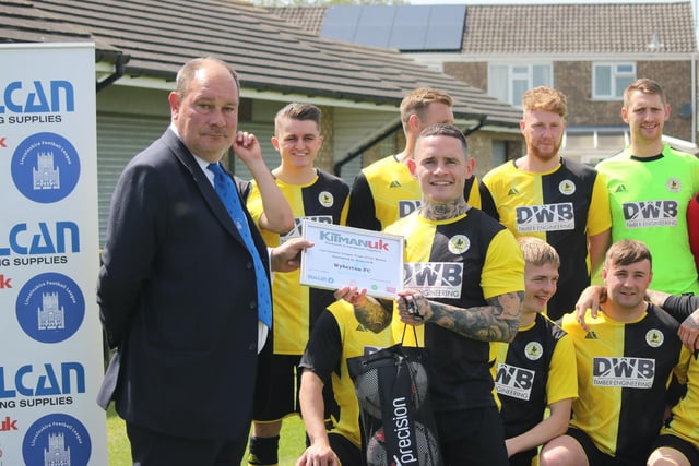 League chairman Julian Rinfret awards the Team of the Month certificate to Grant Butler.