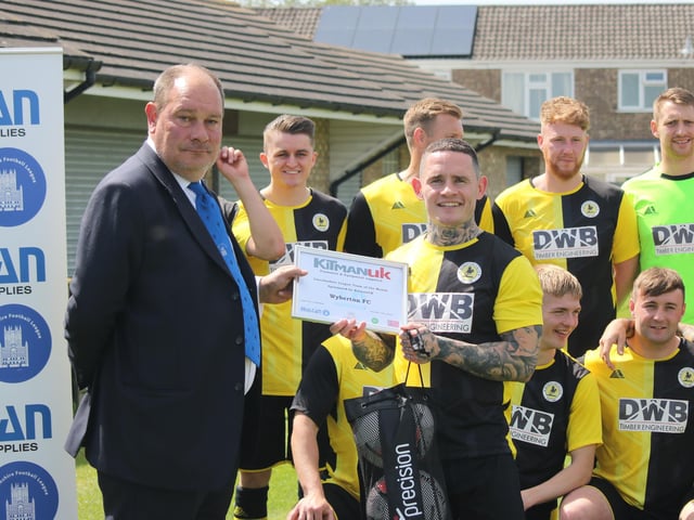 League chairman Julian Rinfret awards the Team of the Month certificate to Grant Butler.