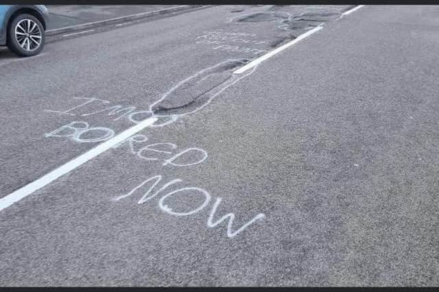 "I'm bored now" says the artist after circling the many potholes.