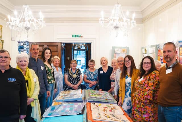 Mayor of Boston Coun Helen Staples and mayoress Jennifer Oglesbee (centre) at the launch of the exhibition, with other guests and Boston Stitchers.