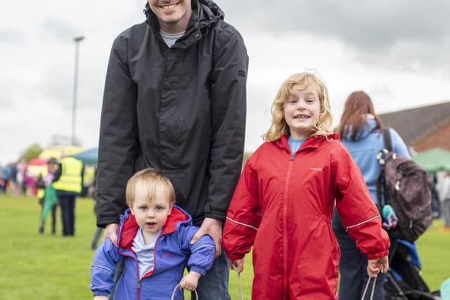 Having a go at circus skills, William Oliver, 1, and Sophie Oliver, 6, with dad Rob Oliver.