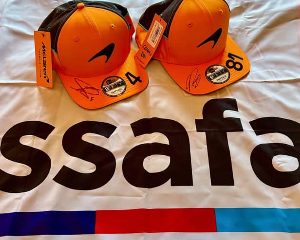 Image 1: The New Era caps signed by Lando Norris and Oscar Piastri.