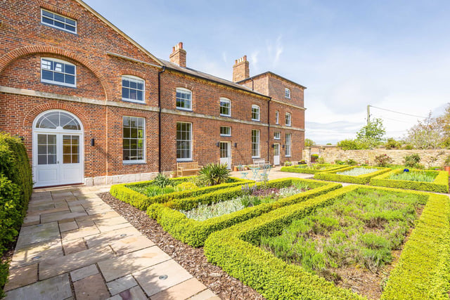 The courtyard gardens of The Carriage House.