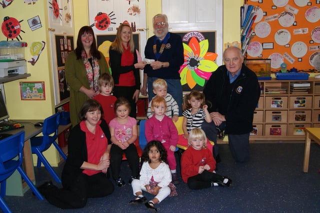 Caistor and District Lions Club donated funds to Rainbow Pre-School 10 years ago to help towards the cost of repairing the heating system. Lions president Reg Hunt is pictured presenting the funds to pre-school manager Jane Carter, alongside Lion Stuart Roach, treasurer Paula Strange, and deputy manager Lou Tinker (front). Pictured children are, standing, Rory Parker and Kayne Delee, seated (from left) Summer Ford, Emeline Myshrall and Jasmine Storrl and, front, Raadhhaa Meher and Lola Chappell.