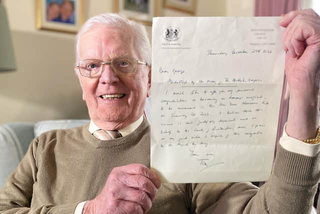 Peter Maddison with the letter confirming his BEM.