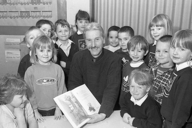 Pupils from Boston's St Nicholas Primary School with departing headteacher John Such. As a leaving present, staff, children and parents bought him a gliding lesson at Crowland Airfield, a penny whistle, and some CDs.