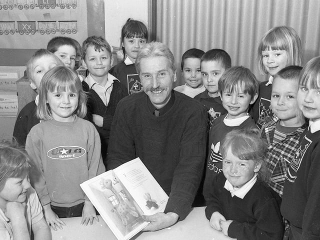 Pupils from Boston's St Nicholas Primary School with departing headteacher John Such. As a leaving present, staff, children and parents bought him a gliding lesson at Crowland Airfield, a penny whistle, and some CDs.