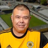 Sir Jonathan Van Tam wearing a Boston United shirt.