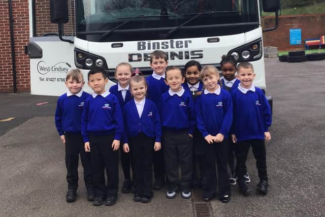 Pupils of Benjamin Adlard School in Gainsborough with their winning lorry name, Binster