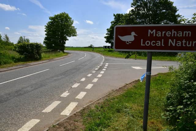 Remnants of police cordon tape on Mareham Lane after the stabbing incident.