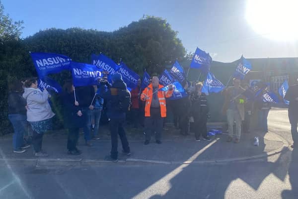 Teachers pictured on strike outside Haven High Academy on Wednesday morning.