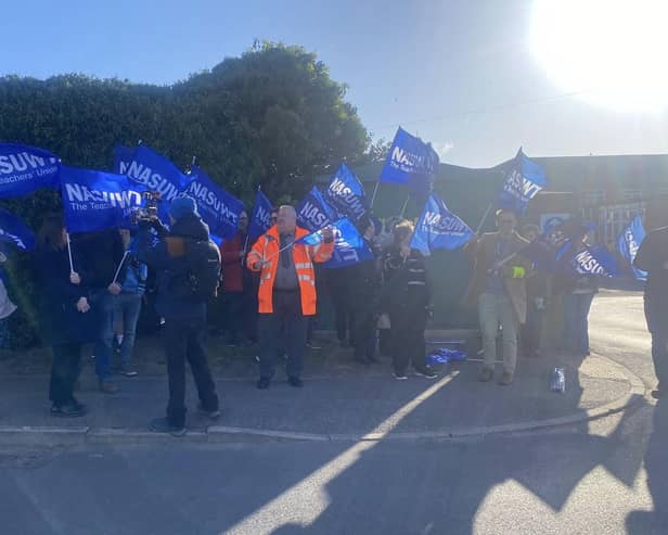 Teachers pictured on strike outside Haven High Academy on Wednesday morning.