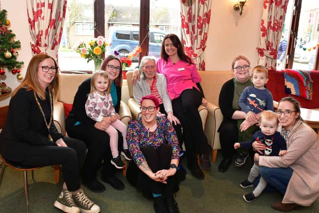 The Mayor of Coningsby, Amanda Bowen, pictured left with staff and residents of Toray Pines and children from Little Acorns Day Nursery. Photos: Mick Fox