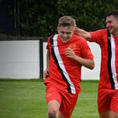 Scott Hutchinson is congratulated after one of his goals. Photo: Brigg Town FC.