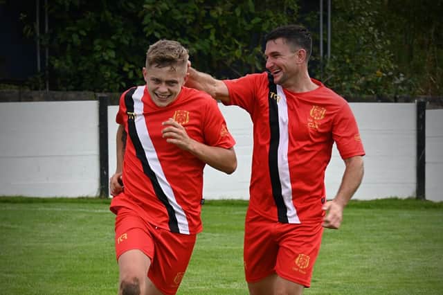 Scott Hutchinson is congratulated after one of his goals. Photo: Brigg Town FC.