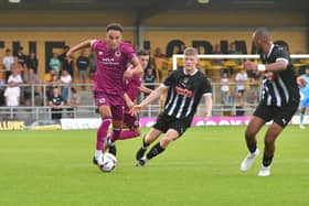 Jai Rowe brings the ball forward in the win over Notts County.