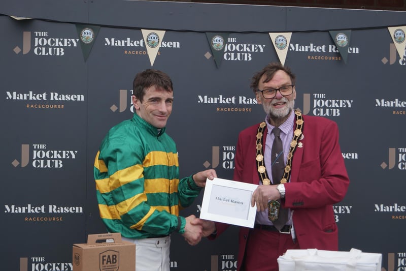 Jockey Brian Hughes collected the prize from Coun Stephen Bunney after his win on Grand D'Oudairies in the Market Rasen Town Council 50th Anniversary Handicap Steeple Chase