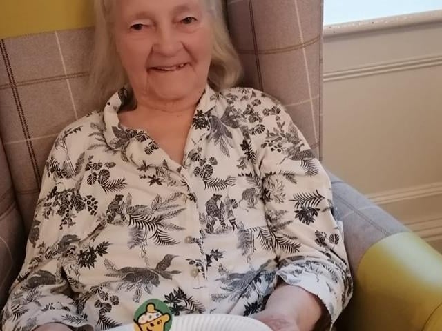 Dorris Power showing off some off her teddy bear's tea party snacks.