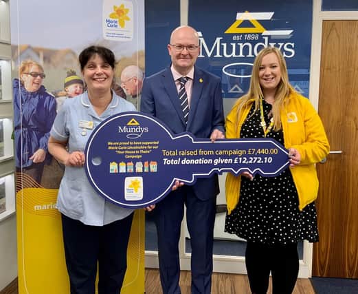 One of the Marie Curie Nurses and Lauren Alexander, Marie Curie Community Fundraiser, with Simon Bentley, Senior Partner at Mundys