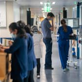 File photo dated 18/01/23 of a general view of staff on a NHS hospital ward, as NHS waiting lists could top eight million by next summer, regardless of whether medics continue striking over pay, according to new analysis.