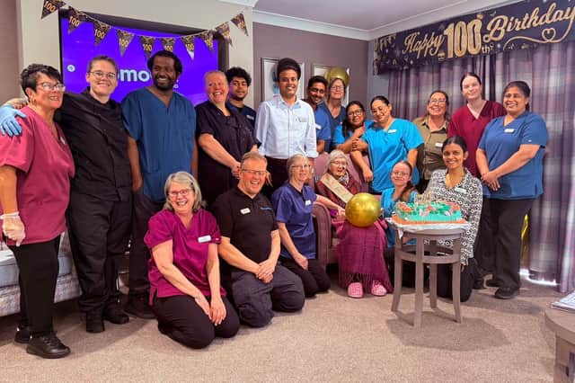 Katriye Sefkat Ariel with staff during her 100th birthday celebrations at Sleaford Hall care home.