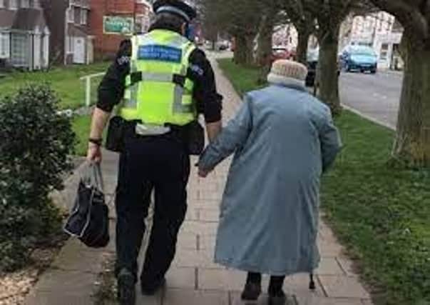 The image of PCSO Bunker helping an elderly lady who got lost in Skegness which went viral on social media.