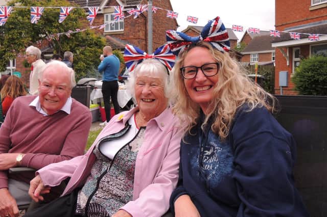 Having a right Royal knees up at the street party in Cobblers Way, Sleaford, from left - Mike Bates, Joan Windever and Babs Thomson.