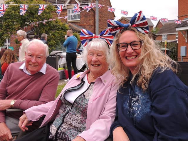 Having a right Royal knees up at the street party in Cobblers Way, Sleaford, from left - Mike Bates, Joan Windever and Babs Thomson.