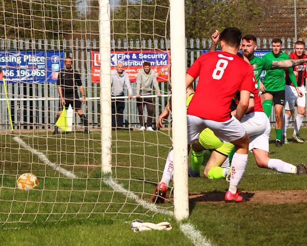 Player-manager Tom Ward (third from right) scores Sleaford's second at Kimberley. Photo: Steve W Davies Photography.
