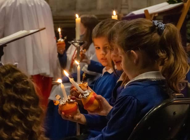 <p>A time for reflection at The News' Christmas Carol Service & Christingle at St Mary's Church last year.  Picture: Alex Shute</p>